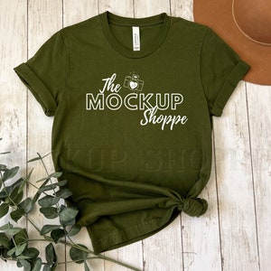May include: A green t-shirt with a white graphic design that says "The Mockup Shoppe" with a camera and heart icon.