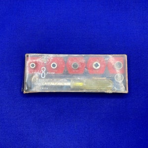 May include: A vintage eight-piece handy socket set in a clear plastic box with a red and white label. The label reads "eight 8 piece HANDY SOCKET SET MADE IN USA".
