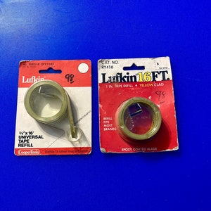 May include: Two packages of tape measure refills. The package on the left is a Coopertools brand 3/4" x 16' universal tape refill. The package on the right is a Lufkin brand 16 ft. 1 in. tape refill with a yellow clad epoxy coated blade.