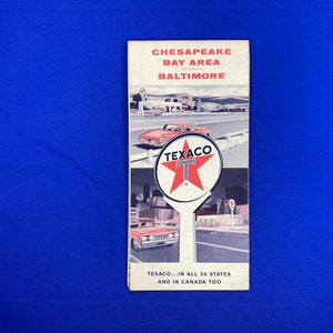 May include: A vintage Texaco road map for the Chesapeake Bay Area and Baltimore. The map features a red Texaco star with a white "T" in the center. The text "TEXACO...IN ALL 50 STATES AND IN CANADA TOO" is printed at the bottom.