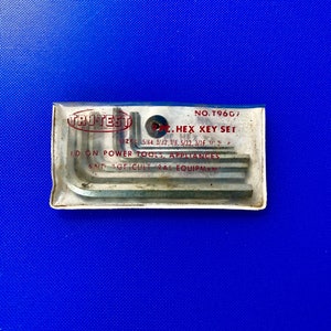 May include: A clear plastic package containing a set of 7 silver hex keys. The package is labeled "TRUTEST 7 PC. HEX KEY SET" and lists the sizes of the keys: 5/64, 3/32, 1/8, 5/32, 3/16, 1/2, and 5/16. The package also states that the keys are "USED ON POWER TOOLS, APPLIANCES AND AGRICULTURAL EQUIPMENT."