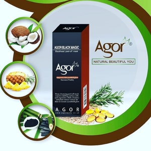 May include: A black and red tube of face mask with the text "AGOR BLACK MAGIC Blackhead peel-off mask" and "Agor" in a white circle. The text "NATURAL BEAUTIFUL YOU" is in a white circle with a black outline. The tube is surrounded by images of pineapple, coconut, bamboo, and rosemary.