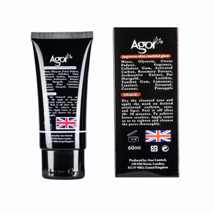 May include: Black and white tube of Agor face mask with the text "improves skin youthful glow" and a list of ingredients. The back of the tube shows instructions for use and a list of ingredients. The tube is 60 ml.