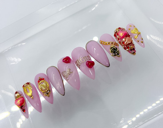 Pretty in pink: Valentine's Day nail art with Zodiac rhinestones.