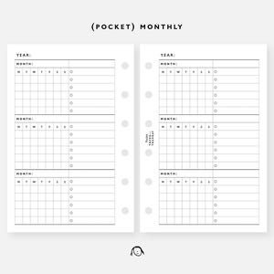 May include: A white planner insert with a monthly layout. The insert features sections for the year and month, with spaces for daily entries and check boxes. The text "(POCKET) MONTHLY" is at the top.
