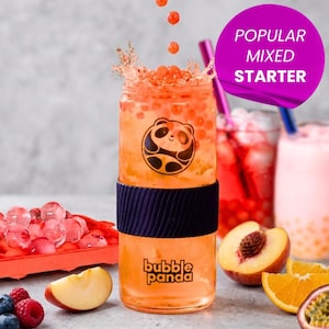 May include: A clear glass tumbler filled with orange liquid and boba pearls, featuring a black panda logo and the text bubble panda. A dark blue silicone sleeve wraps the center. A purple straw is inserted, and a pink circle displays POPULAR MIXED STARTER.