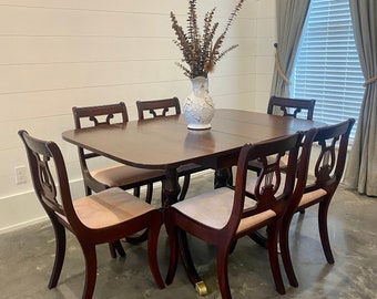 Mahogany Duncan Phyfe dining room set. Six chairs and drop leaf table with additional leaf. Antique