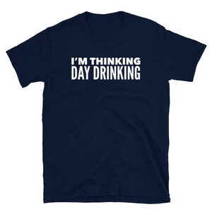 May include: A navy blue t-shirt with white text that reads "I'm thinking day drinking".
