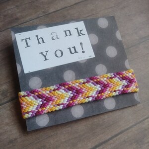 Customizable Handmade Friendship Bracelet Distorted Chevron Pattern Handmade Macramé Pink, Purple, and Yellow