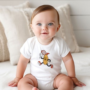 Retro throwback infant  onesie with a corn character waving a NE flag