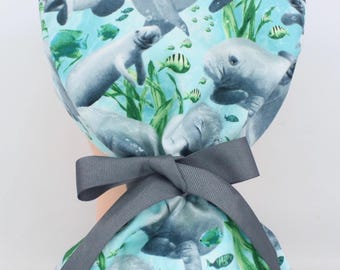 Manatees Pony Tail medical bonnet, Vet Tech bonnet, Scrub cap, Medical cap. Enjoy FREE shipping when you spend 35 dollars or more!