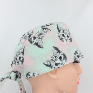 Cats Faces Pink Green Medical Bonnet. Enjoy FREE shipping when you spend 35 dollars or more!