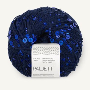 May include: A ball of dark navy blue yarn embellished with vibrant blue sequins. A white paper label is wrapped around the center, featuring the text Sandnes Garn, Den Norske Garnfabrikken Siden 1888, Paljett, and the number 5840 at the top right.