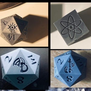 May include: Four different gray and blue dice with various symbols and numbers. The dice are all 20-sided and have a variety of designs, including an eye, an atom, a dragon, and a sword.