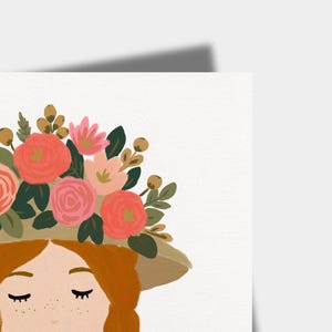 May include: A digital illustration of a person with ginger hair and freckles wearing a wide-brimmed hat adorned with a cluster of flowers in shades of coral, pink, and peach, accompanied by dark green leaves and small brown buds on a white background.