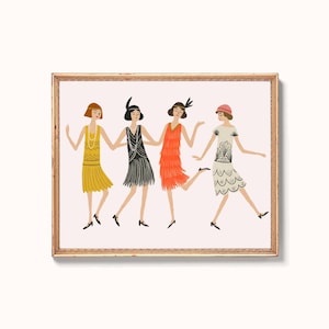 May include: A framed art print featuring four figures in 1920s-style dresses dancing. The figures wear yellow, black, orange, and white dresses with fringe and scalloped details, headbands, and pearls, set against a light pink background.