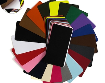 May include: A selection of self-adhesive felt sheets in various colours, including black, white, red, blue, green, yellow, and brown. The sheets are displayed in a fan shape and measure 7.87 inches by 3.93 inches (20 cm by 10 cm).