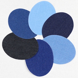 May include: Six denim fabric circles in various shades of blue, arranged in a flower shape.
