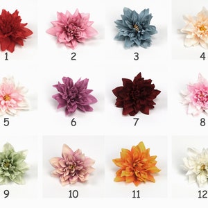 May include: Twelve artificial flower heads in various colours, including red, pink, purple, blue, green, white, and orange. The flowers are arranged in a grid pattern with numbers 1 through 12 below each flower.