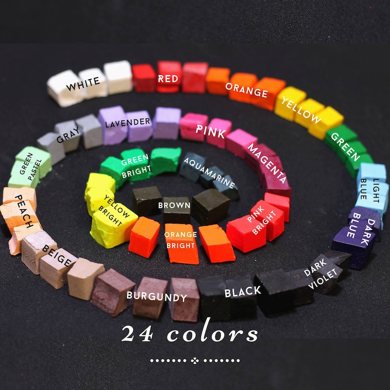 May include: A color wheel with 24 different colored squares arranged in a circle. The colors are labeled with their names, including white, red, orange, yellow, green, blue, purple, pink, brown, and gray.