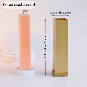 May include: A beige rectangular prism candle mold with a 9.5 inch height and 1.95 inch width. The mold is made of silicone and has a smooth surface.  "Prism candle mold" is written in black text at the top of the image.