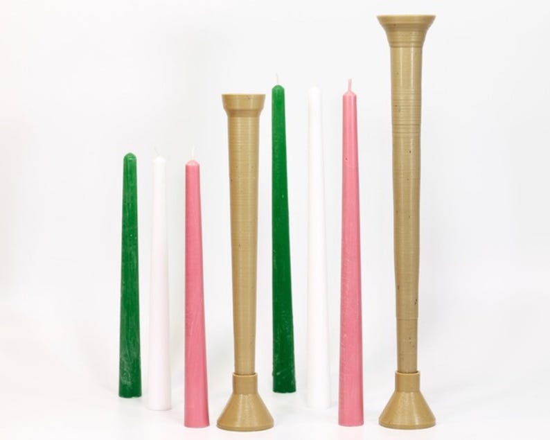 May include: A set of six candles in various colors, including green, white, and pink, with three of the candles in tall, brown holders. The candles are all tapered and have a smooth finish.