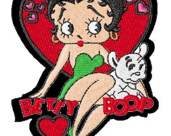 May include: Embroidered patch featuring Betty Boop in a green dress with a white dog, surrounded by red hearts and the text "Betty Boop".