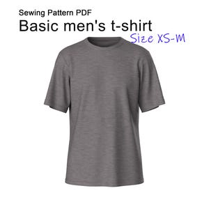 Puede incluir: Una camiseta gris con mangas cortas. El texto "Sewing Pattern PDF" y "Basic t-shirt" están en la parte superior. La talla es XS-M.