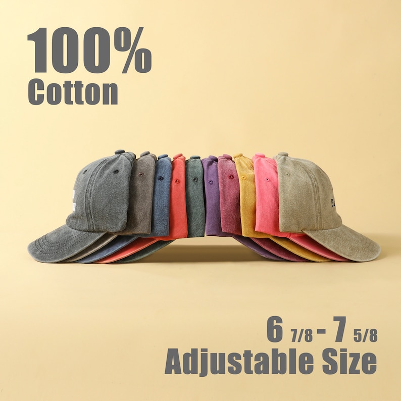 May include: A row of 10 baseball caps in various colors, including gray, blue, red, purple, yellow, and pink. The caps are made of 100% cotton and have an adjustable size of 6 7/8 - 7 5/8.
