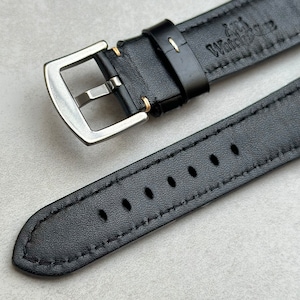 Rear of the Oslo black full grain leather watch strap. Contrast ivory stitching, brushed 316L stainless steel buckle.