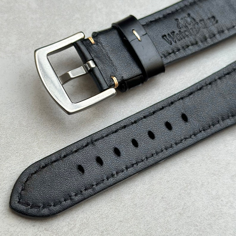 Rear of the Oslo black full grain leather watch strap. Contrast ivory stitching, brushed 316L stainless steel buckle.