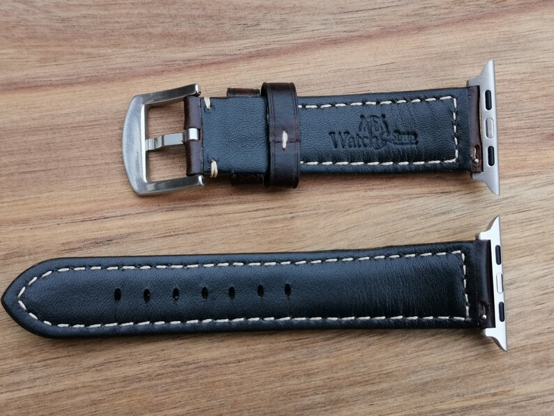Underside of the Berlin brown leather apple watch strap. Picture shows the Watch and Strap logo debossed into the rear of the strap and the soft black leather lining.