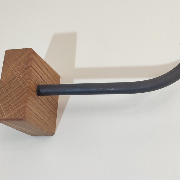 Toilet paper holder made of oak wood and steel. Modern toilet paper holder