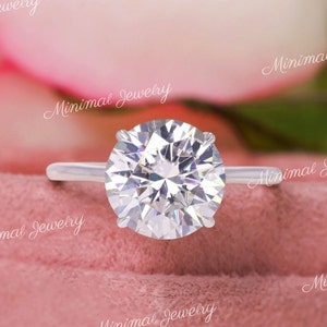 round cut moissanite engagement ring with hidden halo