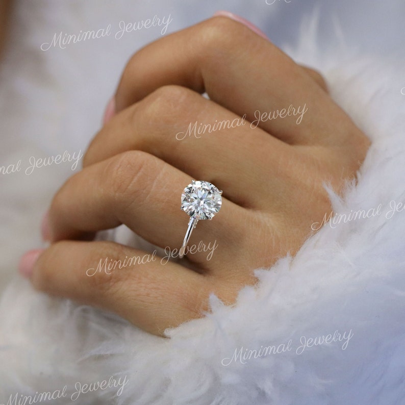 round moissanite engagement ring with hidden halo in 14k white gold
