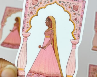 May include: A sticker featuring a woman in a pink dress and a veil, standing under a pink and gold archway with intricate floral designs. The woman is holding a small pink flower.