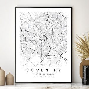 May include: Black and white map print of Coventry, United Kingdom. The map shows the city streets and landmarks. The text "COVENTRY" and "UNITED KINGDOM" are printed below the map, along with the coordinates "52.4068&deg; N, 1.5197&deg; W".