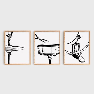 May include: Three black and white illustrations of a drum set. The first illustration shows a cymbal with a stand. The second illustration shows a snare drum with a stand and drumsticks. The third illustration shows a bass drum with a pedal.
