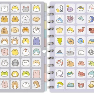 May include: A spiral bound notebook with two sections. The left side features a grid of 48 colorful cartoon animal illustrations. The right side features a grid of 48 colorful cartoon sea creature illustrations.