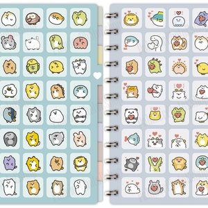 May include: A spiral bound notebook with a light blue cover featuring a grid of colorful cartoon animal illustrations. The illustrations include a variety of animals such as cats, dogs, frogs, and fish. The notebook is divided into two sections, one with the animals in their natural form and the other with the animals holding hearts.