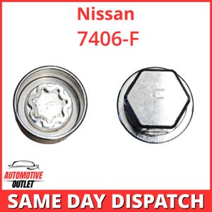 May include: Two silver-colored metal Nissan wheel lock lug nuts, model 7406-F. One nut shows a circular, serrated internal pattern, while the other displays a hexagonal outer head with the letter F engraved on the top surface of the metal.