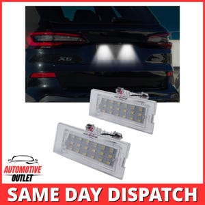 May include: Two rectangular LED number plate light assemblies with clear plastic housings and multiple internal light diodes. Each unit features the brand name ANG RONG printed on the lens and includes a metal connector at the top for installation.