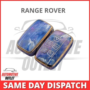 May include: Two Range Rover key fobs with a blue and purple marbled design and gold trim. The key fobs have multiple buttons with symbols.
