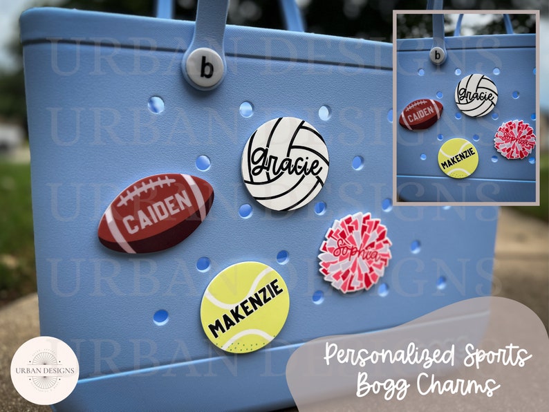 May include: Personalized sports-themed charms for a blue Bogg bag. The charms feature a football, volleyball, tennis ball, and a cheerleading pom-pom. Each charm has a name on it: Caiden, Gracie, Mackenzie, and Sophia.