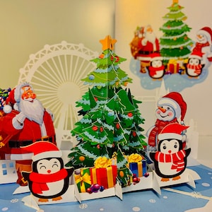 Festeggia il Natale con Babbo Natale, Pupazzo di Neve e Pinguino ~ Biglietto d'auguri di Buon Natale pop-up 3D Acquista online https://origamipopcards.com/