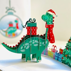 Babbo Natale con dinosauro con regali di Natale 3D Pop Up Merry Christmas Greeting Card Acquista online https://origamipopcards.com/ Buone feste