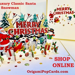 Puede incluir: Una tarjeta de Navidad pop-up 3D con Papá Noel y un muñeco de nieve en una escena de invierno. La tarjeta está abierta y el pop-up es visible. La tarjeta dice "Feliz Navidad" en el frente y "Comprar en línea OrigamiPopCards.com" en la parte inferior.