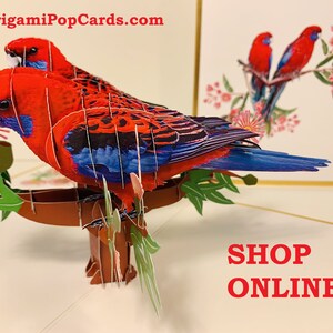 Tarjetas de felicitación 3D de origami pop-up de lujo con diseño de pareja de loros australianos, rosellas carmesí, dorados y dorados. https://origamipopcards.com/