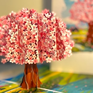 Plum Pink Cherry Blossom Tree on Green Fields Pop Up Greeting Card Happy Birthday Origami Pop Cards Shop Online https://origamipopcards.com/