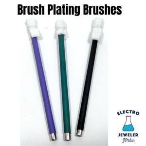 May include: Three plating brushes with white foam tips. The brushes are purple, green, and black.
